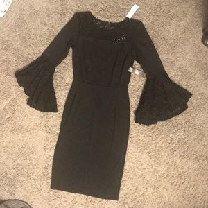 Lace bell sleeves and lace neckline.